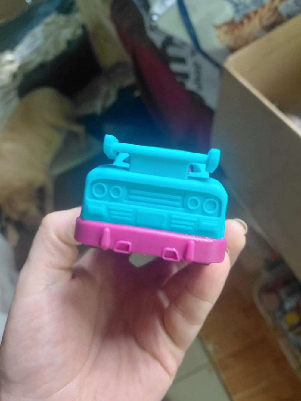 B. toys Happy Cruisers mini race car featuring a vibrant blue body with contrast